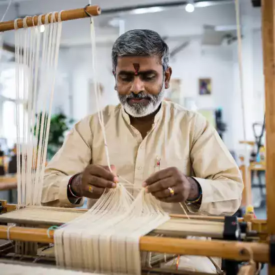 Dye master Amir Hassan preparing natural plant-based dyes using indigo madder root turmeric in traditional copper vessels for authentic color preservation